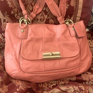 This beautiful salmon bag is in perfect condition